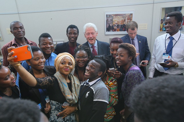 Posing for a selfie with President Bill Clinton, the founding chairman of the Clinton Global Initiative